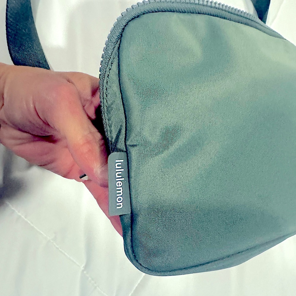 Lululemon crossbody bag 2L in sage green.